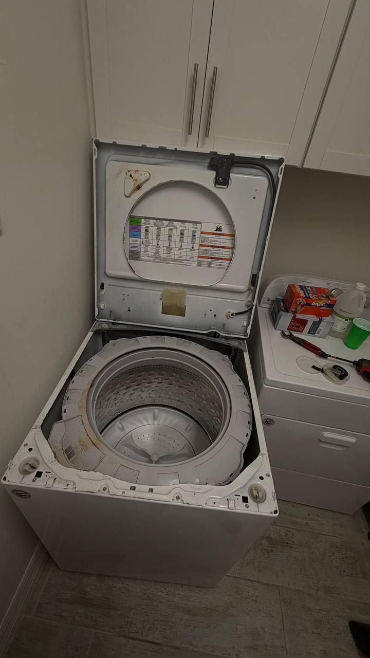 Whirlpool washer opened with drum exposed for repair